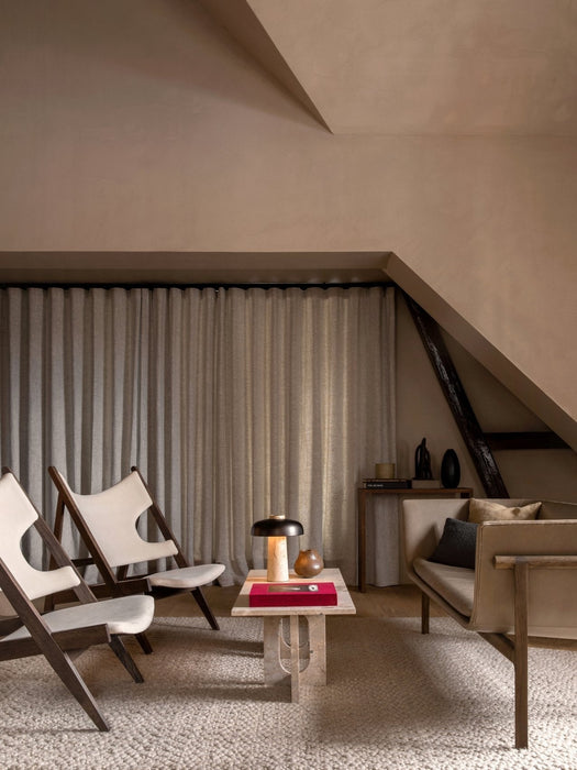 Living room with the Reverse Table Lamp on an Androgyne Lounge Table, flanked by Knitting Chairs and a Tailor Sofa.
