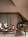 Living room with the Reverse Table Lamp on an Androgyne Lounge Table, flanked by Knitting Chairs and a Tailor Sofa.
