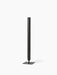 Audo Copenhagen Stance Vase H50 in bronzed brass. A tall, slender cylindrical vase with a dark finish on a flat square base.