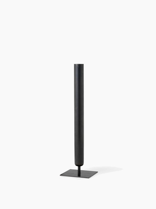 An angle view of the Stance Vase in bronzed brass. The tall vase has a slender cylindrical shape and a flat square base.
