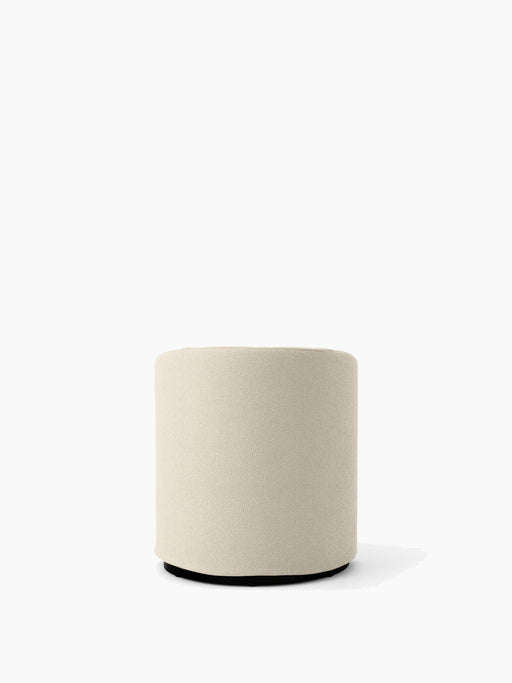 Rear view of the base of the Tearoom Club Chair, a cylindrical shape upholstered in Logan Jasmine loose cover fabric.