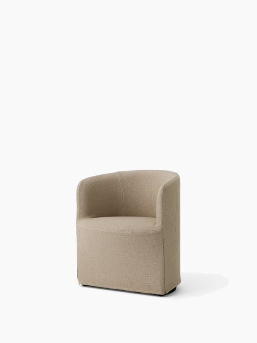 The Tearoom Club Chair with a loose cover in sand-coloured Logan fabric, shown at an angle against a plain white background.
