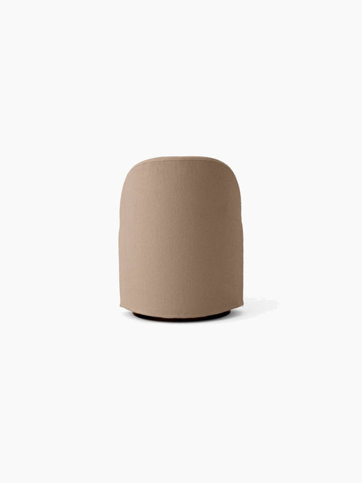Back view of the Tearoom Club Chair with Swivel, upholstered in textured Logan Flint fabric, showcasing its rounded form.