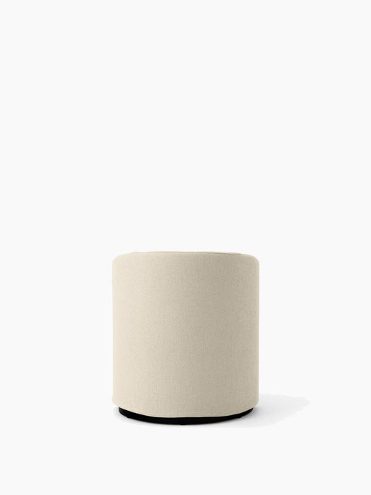 The cylindrical Tearoom Pouf upholstered in light beige Logan Jasmin fabric, shown from the front against a white background.