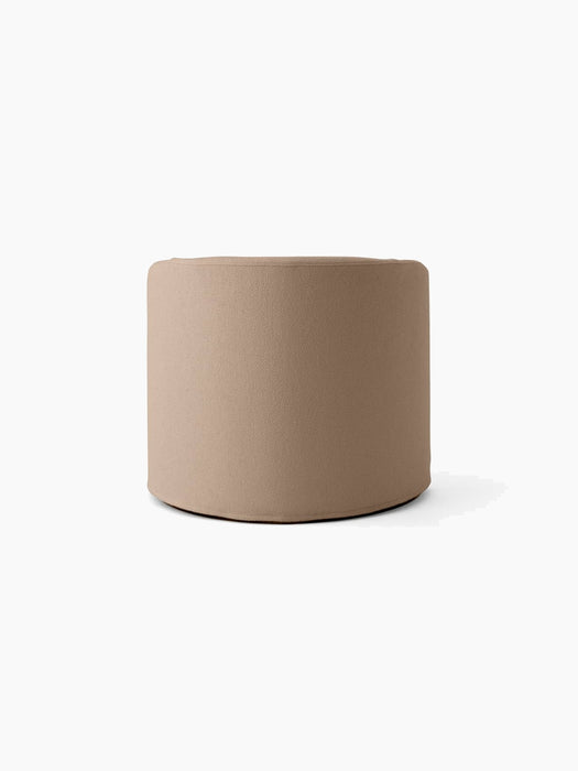Back view of the Tearoom Lounge Chair with a textured Logan Flint loose cover, showcasing its simple, rounded form.