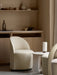 Tearoom Club Chair, Androgyne Side Table, and Hashira Table Lamp styled in a neutral-toned room with wooden cabinetry.