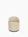 Front view of the Tearoom Club Chair, Swivel w/ Return, upholstered in a light beige textured fabric on a black swivel base.
