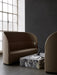 A Tearoom Sofa High Back and Lounge Chair in a minimalist room with a marble Plinth Grand and Interconnect Candle Holder.