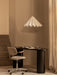 The black Eclipse Desk is paired with a Co Task Chair under a white Dancing Pendant lamp in a softly lit, neutral-toned room.