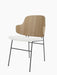 The Penguin Dining Chair, viewed from an angle, with a natural oak back, white textured seat, and thin black metal frame.