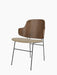 Three-quarter back view of The Penguin Dining Chair with a walnut veneer back, beige upholstered seat, and black metal legs.