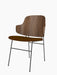 An angled view of The Penguin Dining Chair, showing its walnut veneer back, brown fabric seat, and slim black metal legs.