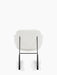 A back view of The Penguin Rocking Chair, showing its light grey upholstered seat and back on a slender black steel frame.