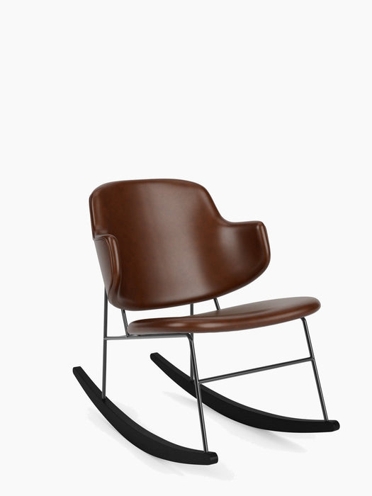 Angled view of The Penguin Rocking Chair, fully upholstered in brown leather, with a black steel frame and black rockers.
