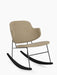 The Penguin Rocking Chair, Fully Upholstered, in beige fabric with a slim black metal frame and black wooden rocking legs.