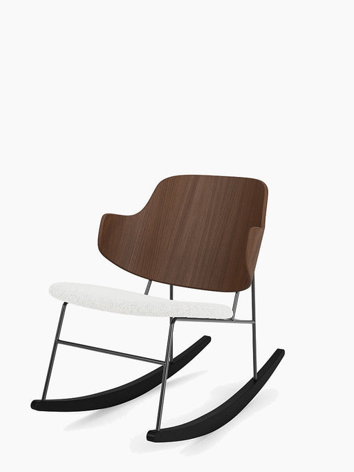 Angled view of The Penguin Rocking Chair with a walnut veneer backrest, a white upholstered seat, and a black steel frame.