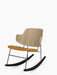 Angled view of The Penguin Rocking Chair with a natural oak backrest, tan leather seat, and a black frame and rockers.
