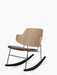 The Penguin Rocking Chair, shown from the side, with a natural oak backrest, a brown leather seat, and a black steel frame.