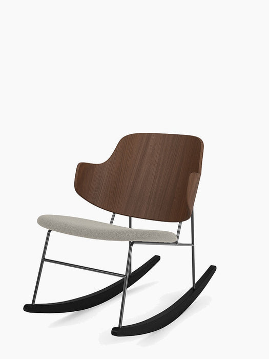 The Penguin Rocking Chair with a walnut backrest and light grey upholstered seat, on a black metal frame with black rockers.