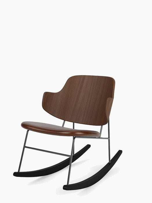 The Penguin Rocking Chair, angled view. Curved walnut veneer back and seat on a slender black steel frame and rockers.