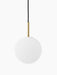 A TR Bulb Pendant light with a spherical white opal glass shade, a brushed brass fixture, and a black suspension cord.