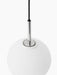 A close-up of the TR Bulb Pendant, showing the polished steel fitting where the black cord meets the white opal glass bulb.