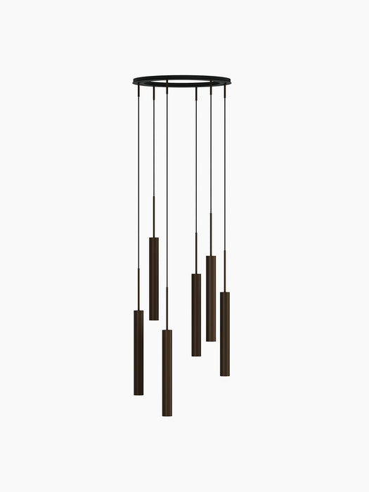 A rendering of the Tubulaire Chandelier with 6 reeded, bronzed brass pendants hanging in a cascading spiral formation.