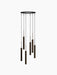 A rendering of the Tubulaire Chandelier with 6 reeded, bronzed brass pendants hanging in a cascading spiral formation.