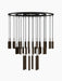 A tiered Tubulaire Chandelier with a black circular frame and 38 bronzed, reeded pendant lights against a white background.