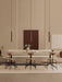 Three bronze Tubulaire Pendant Lamps above an Eave Dining Banquette, Harbour Column Tables, and Afteroom Dining Chairs.