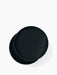 Top-down view of the black ash Turning Table, its circular lid partially rotated to show the storage space beneath.