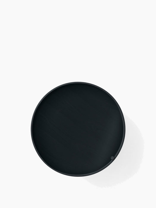 A top-down, bird's-eye view of the round Turning Table in Black Ash, showing the wood grain and raised edge of the tabletop.