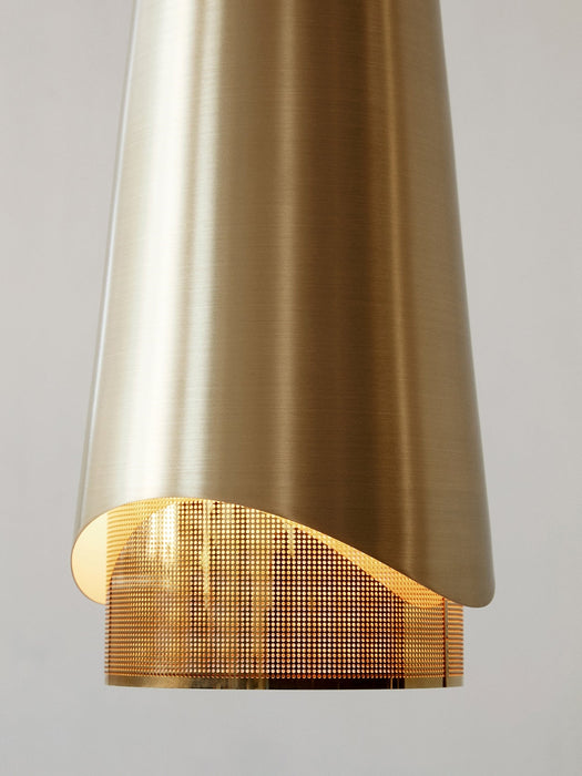 A close-up of the Umanoff Pendant, showing the brushed brass shade with a curved cutout revealing a perforated inner layer.