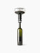 A studio shot of the glass Wine Breather Carafe by Norm Architects aerating red wine from a bottle against a white background