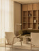 A calm living room with two Elizabeth Lounge Chairs, an Androgyne Lounge Table, an Eave Modular Sofa and a Wing Floor Lamp.