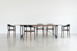Brut Dining Table american anthracite black glass grey smoked walnut - ambient
