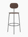 Front view of the Afteroom Bar Chair Plus, Veneer, with a dark stained oak seat and backrest on a slender black frame.
