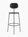 A black Afteroom Bar Chair Plus, Veneer, viewed from the front, with a thin metal frame and a wooden seat.