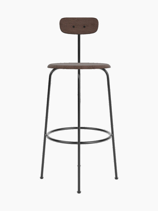 A front view of the Afteroom Bar Chair, Veneer, in dark stained oak with a slim, black powder-coated steel frame.