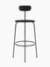 Front-on view of the Afteroom Bar Chair, Seat Upholstered, in black with a minimalist steel frame and a low backrest.