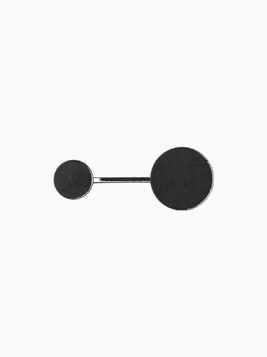 A front view of the small Afteroom Coat Hanger in black and brass, featuring two circular hooks of different sizes on a bar.