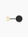 Top-down view of the small Afteroom Coat Hanger in black, with its large matte black disc and smaller brushed brass hook.