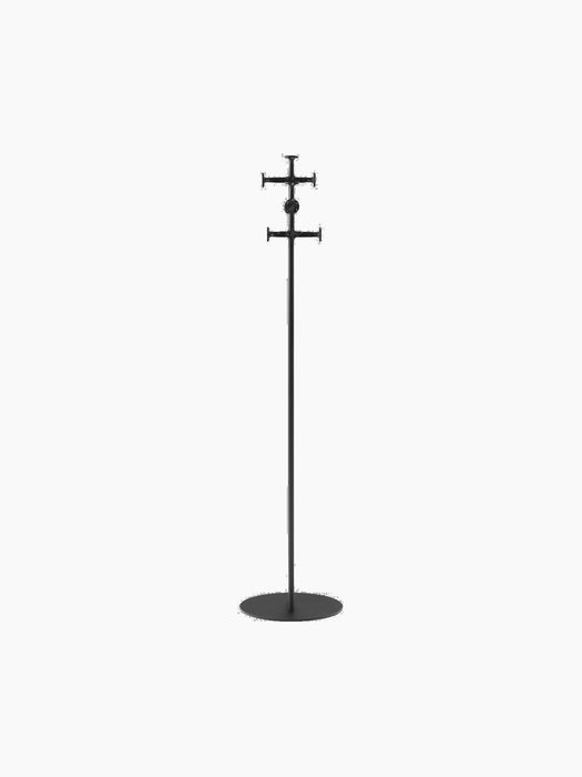 A tall, minimalist black coat stand with a slim pole, flat circular base, and two sets of cross-shaped hooks.