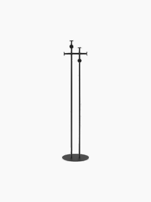 Back view of a minimalist black coat stand featuring two tall poles on a circular base and hooks at varying heights.