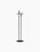 Back view of a minimalist black coat stand featuring two tall poles on a circular base and hooks at varying heights.