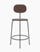 A front-on studio shot of the Afteroom Counter Chair Plus, Veneer in dark stained oak with a black powder-coated steel frame.