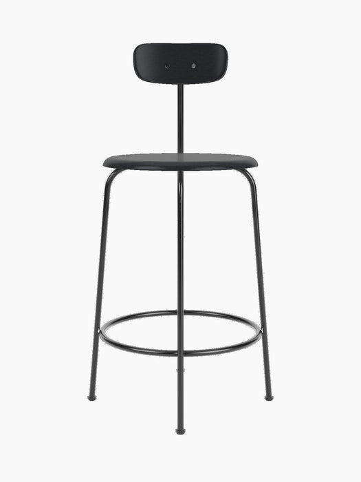 Front view of the Afteroom Counter Chair in black veneer. The chair has a slim metal frame, a round seat, and a low backrest.