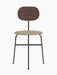 Afteroom Dining Chair Plus with a dark stained oak backrest, a light beige upholstered seat, and a black steel frame.
