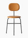 The Afteroom Dining Chair Plus with a slim black frame. The round seat and oval backrest are upholstered in tan Dakar leather