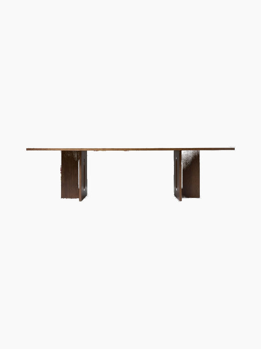 Front view of Androgyne Dining Table, Rectangular in dark stained oak, showing its long tabletop and wide sculptural legs.